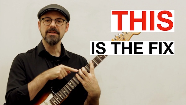 Why your pinky curls inward on guitar and how to fix it with wrist position